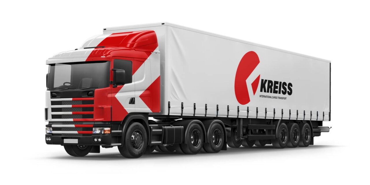 A red and white semi truck is shown.